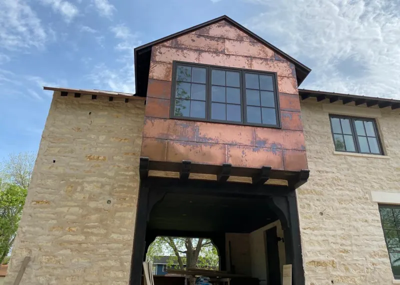 Copper metal panel facade on a stone building for Roof Repair in Miami Shores